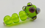 Chartreuse with silver glass dots encased in clear bumps to magnify the reaction.